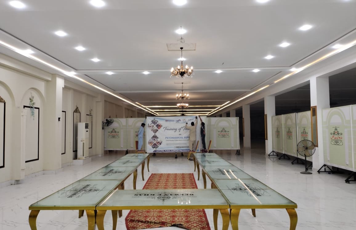 Crown Hall with chandeliers and gold-leg glass tables