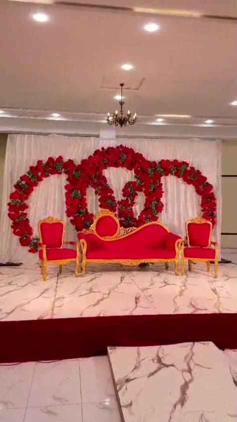 Imperial Hall stage with floral rings and gold-and-red seating