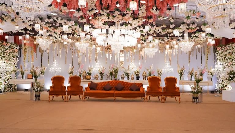 Floral chandelier stage with velvet seating