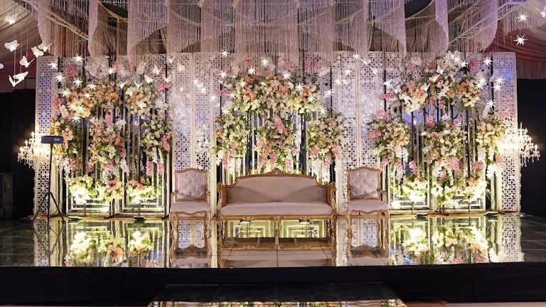Mirror-panel stage with floral and butterfly accents