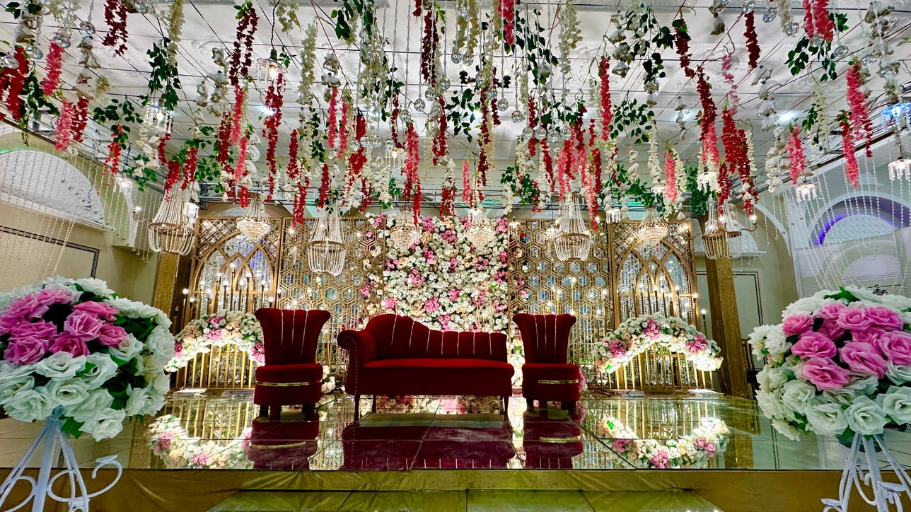Mirror-floor floral stage with hanging garlands